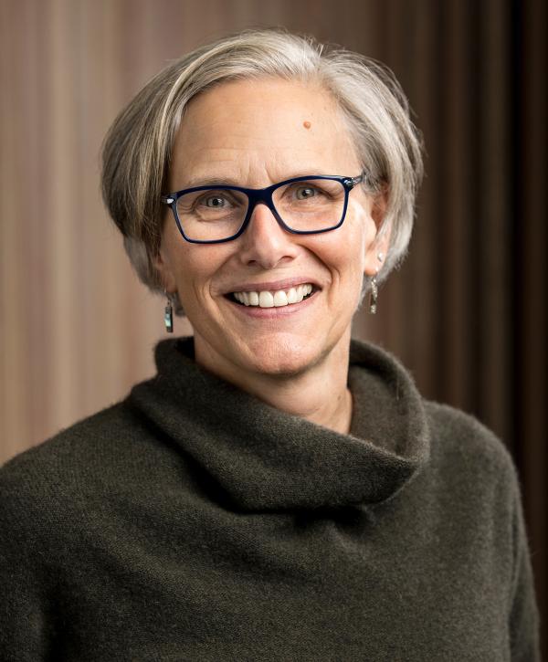 Headshot of Alix Gitelman against a light backdrop