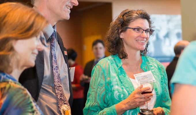 Faculty chatting with one another